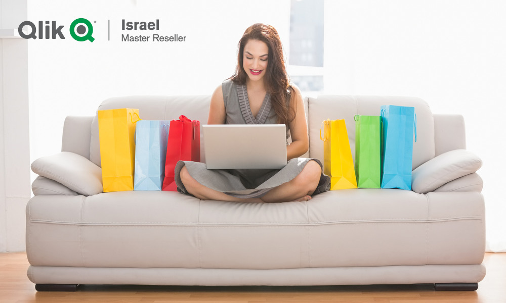 woman sitting on a sofa with laptop